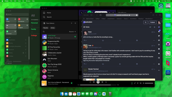 My macOS desktop. A green polygonal wallpaper backdrops Reminders, Spotify and Safari.