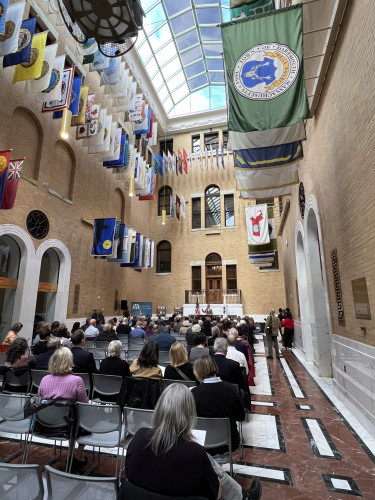 Great Hall, Boston State House: created from a former courtyard in the new section of the structure, it has beige brick walls and a gabled glass ceiling. Around the top of the walls are the flags of the towns and cities of Massachusetts: a great aesthetic, though the motivation for hanging them was to dampen noise