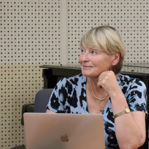 Sue Onslow behind her computer