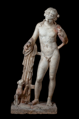 A statue of Dionysos and his pet panther. The panther raises her paw towards the god, a collar of vine around her neck. Dionysos looks lovingly down at her.