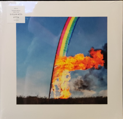 Sigur Ros - Atta cover with sticker saying limited edition clear. Picture is a rainbow flag on fire at the bottom up