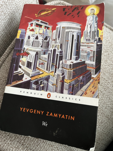 Cover of the Penguin Classics version of We featuring a futuristic city full of tall buildings and various aircraft.