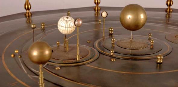 Antique brass orrery, a mechanical model of sun, moon, earth orbit.