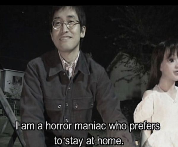 Picture of Junji Ito smiling with text that says "I am a horror maniac who prefers to stay at home."