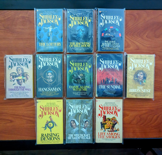 A complete collection of vintage Popular Library paperbacks of Shirley Jackson's work with cover art by William Teason