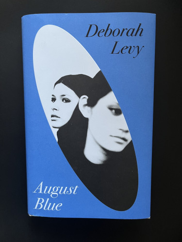 Cover of UK hardback of Deborah Levy’s Autumn Blue. Monochrome photo depicts two cool-looking women who could easily be in the band Ladytron.