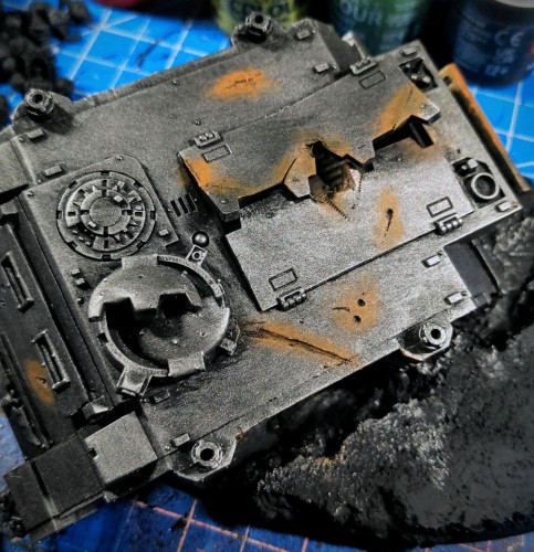 Crashed Space Marine Rhino APC from Games Workshop. Silver/Iron metallic underlayer with heavy rusting effect. 