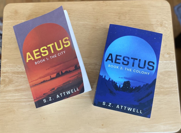 Aestus 1 and 2 on a wooden table.