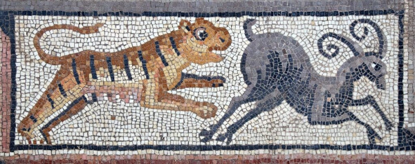 A mosaic panel with a white background and a black border. A cute looking tiger appears to leap after a cute looking goat(?).