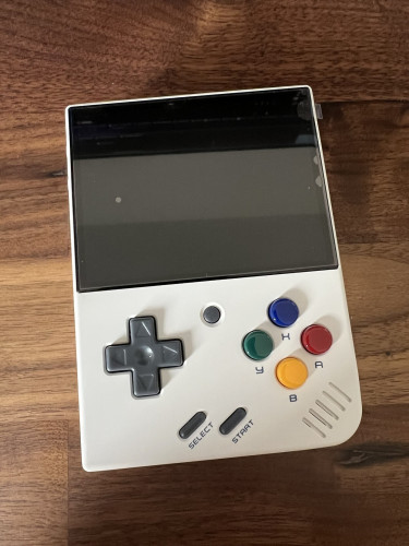 Photo of a Miyoo Mini Plus in White. It looks similar to a Game Boy.