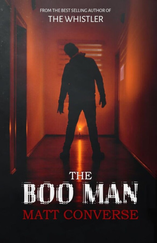 Cover - The Boo Man by Matt Converse - Silhouette of a man standing in a hallway, legs apart, head tilted, backlit by an orange candle