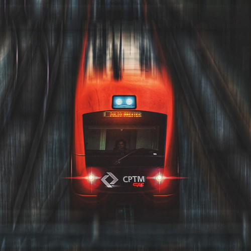 Blurred photo of a red train car in motion