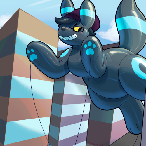An inflatable parade balloon, of a shiny Umbreon who looks a bit flustered about it!
