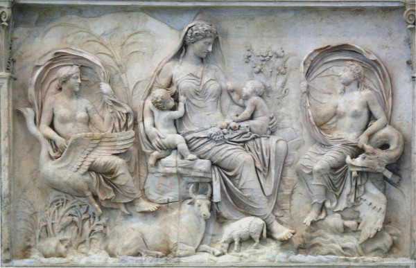Relief showing a woman (goddess??) nursing two infant children. She is surrounded by lush vegetation and animals as well as two female divinities with billowing fabric.