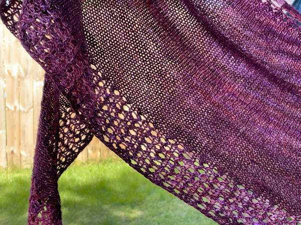 Burgundy crescent shaped shawl with lace edging