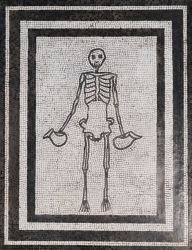 A black skeleton holding jugs against a white background. The borders are alternating black and white bands.