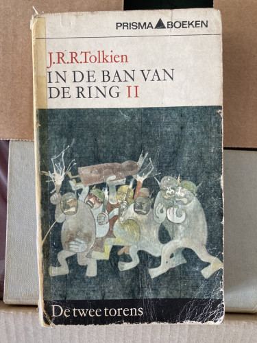 Dutch edition of the Lord of the Rings with a cartoonish illustration showing orcs carrying a wrapped-up hobbit 
