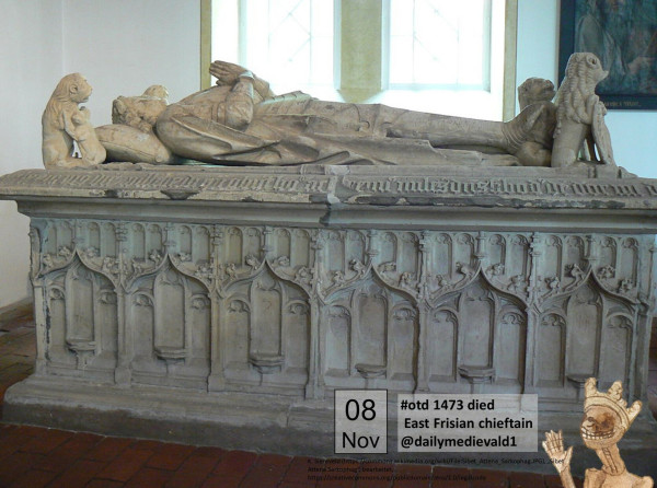 A high tomb made of white stone with a reclining figure