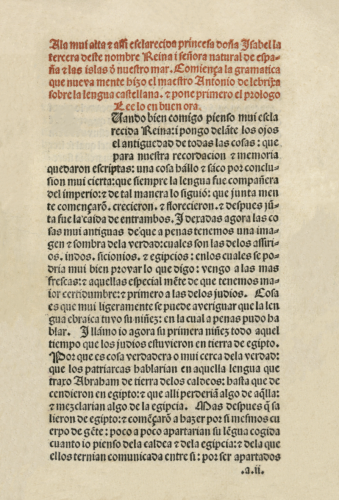 The first page of the Gramatica de la lengua castellana - or Grammar of the Castilian Language, published in 1492. The top part of the page is in red text, and the bottom is in black. It is all in Spanish - and is the dedication to Queen Isabel and part of the prologue.
