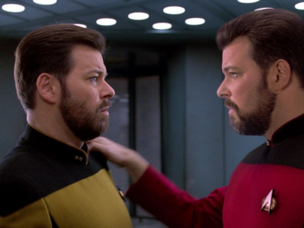 Tom and Will Riker facing each other with confused looks. 