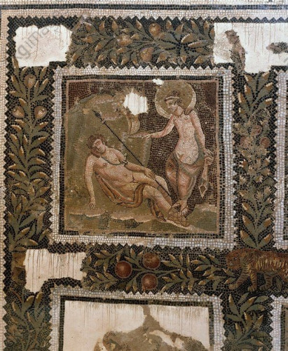 Detail of a Roman mosaic of Selene and Endymion. She has her iconic billowing cloak around her head, the cloth around her hips slipped down enough to reveal her pubic triangle. Endymion is asleep, a spear in his arm and a sword girded around his shoulder.