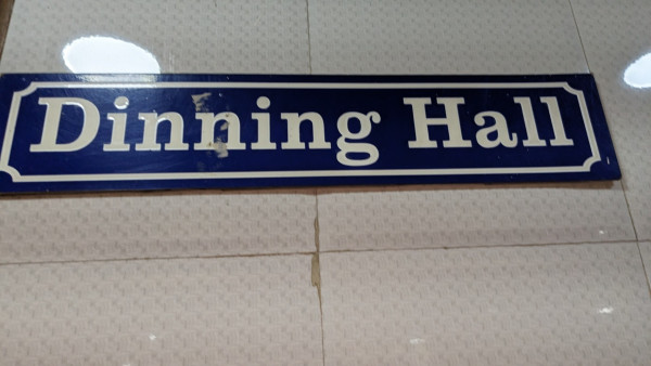 Board in a marriage hall saying "dinning hall"