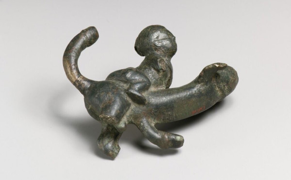 Description from the museum: “This ornament probably hung as a charm from a tintinnabulum, a wind chime adorned with bells and intended to ward off evil. These phallic tintinnabula were doubly apotropaic, the protective effect of the phallus strengthened by the ringing of the bells. The phallus on these objects could take many different forms, transforming into a wolf, dog, beast, lion, monster, or winged creature.”