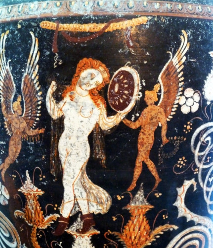 Vase painting of Aphrodite. She is depicted as having blond or red hair adorned by a golden crown. She is in the nude, flanked by to equally nude Erotes, probably Eros and Himeros who are said to have been present at her birth according to the account of Hesiod.