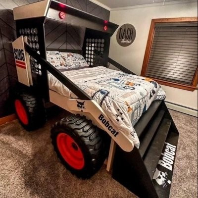A picture of a bed in the shape of a bulldozer