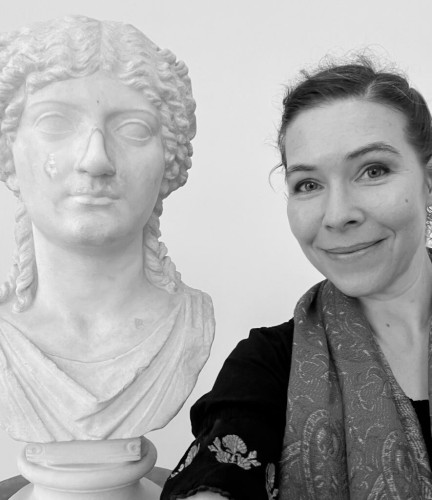 Dr G standing next to a bust identified as Agrippina. The bust has been restored with a nose.