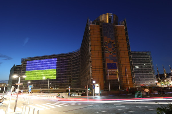 The Berlaymont illuminated at night with the colours of the Ukrainian flag