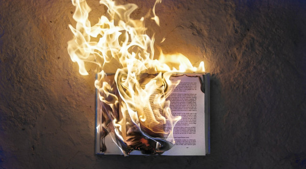 Open book being burned