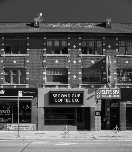 Black and white photograph of a closed coffee-shop called "Second Cup"