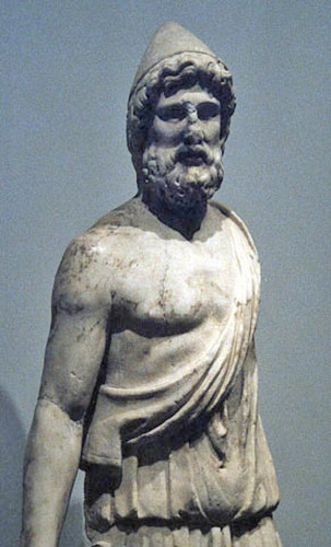 Marble statue of Hephaistos in a worker's hat and exomis, a tunic-like garment that leaves one breast bare.
