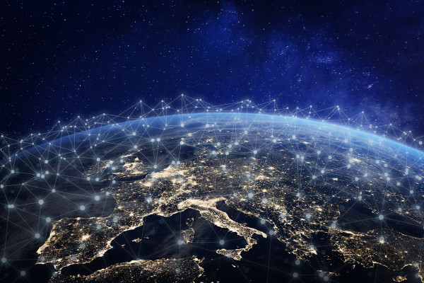 A photo showing the view of Europe from space. 

The photo is edited to include many connections made of light uniting various places in the continent and abroad. 