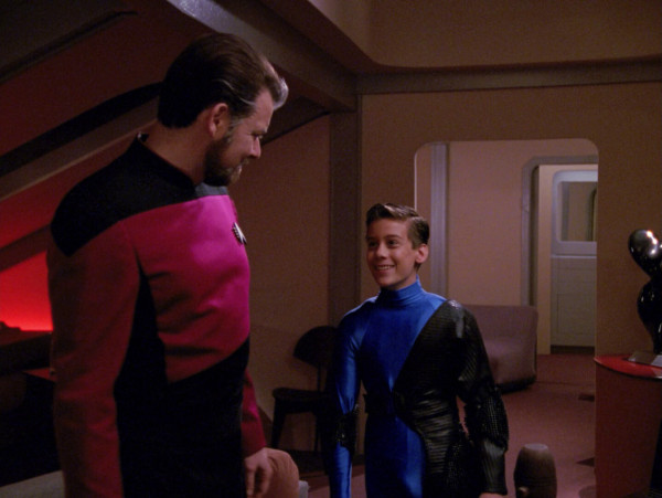 An older Riker with a boy who claims to be his son