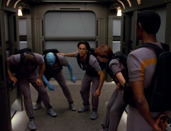 Tuvok looking over misfit Maquis crew who are doubled over from running laps on the ship