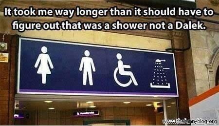 A pictographic sign above a restroom displays symbols for binary genders and a wheelchair for disabled access. The fourth symbol indicates shower facilities, however, it has an uncanny resemblance to a Dalek. 

Caption: It took me way longer than it should have to figure out that was a shower not a Dalek. 

 ~ www.thefunryblog.org