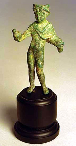 Mercurius stands nude except for a chlamys cloak curled round his arm and a winged traveller's hat (petasos). In his right outstretched hand he carries a leather purse filled with coins, his left hand was sadly lost in antiquity. He is 8.4 cm (3.3 inches) tall. The figurine is made from solid cast bronze with a natural hard green patina.