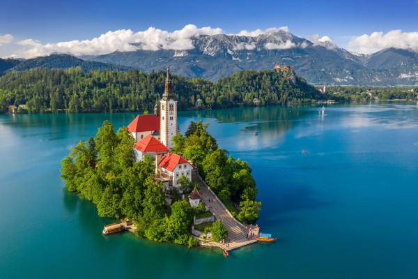 Aerial view of Lake Bled (Blejsko Jezero), in Slovenia, with the Pilgrimage Church of the Assumption of Mary built on a small island.

(Photo © Adobe Stock)