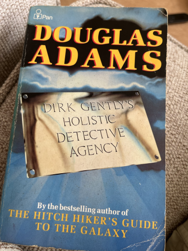 Front cover of the Pan edition of Dirk Gently’s Holistic Detective Agency with the title shown on a gold door plaque