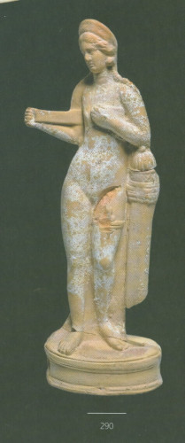 Terracotta statuette of Aphrodite putting on her strophion. She wears a headband and large round earrings and also a strap or thigh band at the left thigh. Some traces of paint are left on this statuette.
The statuette is described as a late Hellenistic-early Roman work, found in the House of Orpheus, in Paphos.