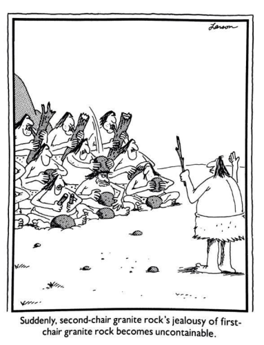 Gary Larson cartoon. Ensemble of cave people beating on rocks and sticks, led by a cave person conductor. Caption: Suddenly, second-chair granite rock's jealousy of first-chair granite rock becomes uncontainable.