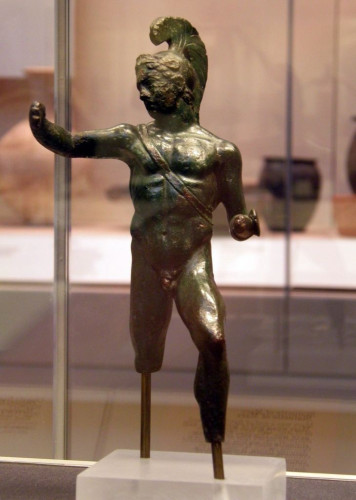 Bronze statuette of Ares-Mars. He is in the nude wearing only a crested helmet. A sword belt crosses his chest. The items he used to hold are now lost, one of them most likely a spear.