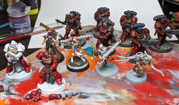 Warhammer 40k Space Marine Infernus squad, some Adepta Sororitas Repentia showing a lot of flesh, two Blood Angels Strenguard just started.