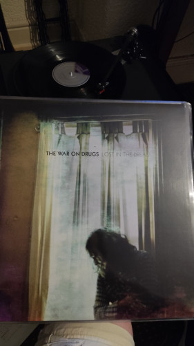 The War On Drugs Lost in the dream vinyl cover and and vinyl being played 