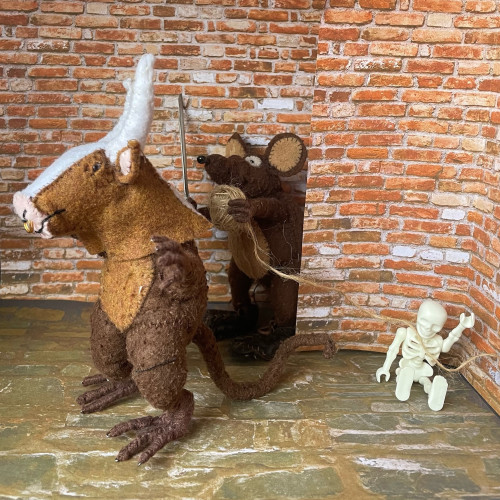 Photo of Minimus and Minima, the Latin mice. Minimus is Theseus, creeping up on the Minotaur (also known as Minima) from behind a wall in the labyrinth