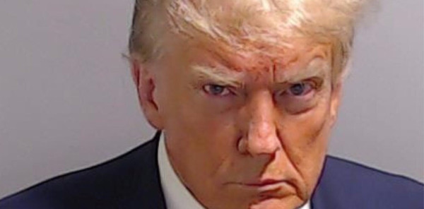 Mug shot of Donald J. Trump glaring at the camera