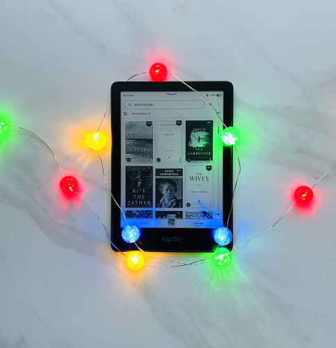 My Kindle, surrounded by Christmas lights.