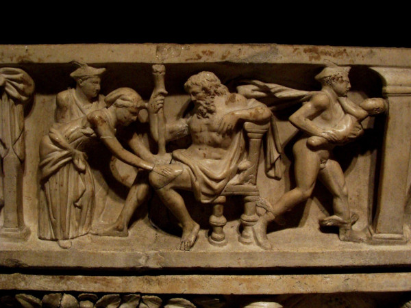 Relief of Zeus, just having given birth to Dionysos. A goddess is taking care of Zeus' thigh while Hermes is hurrying away with baby Dionysos in his arms.
